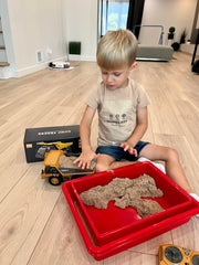 KIDMARKT RC Dump Truck left-side view highlighting rugged alloy body for durable fun