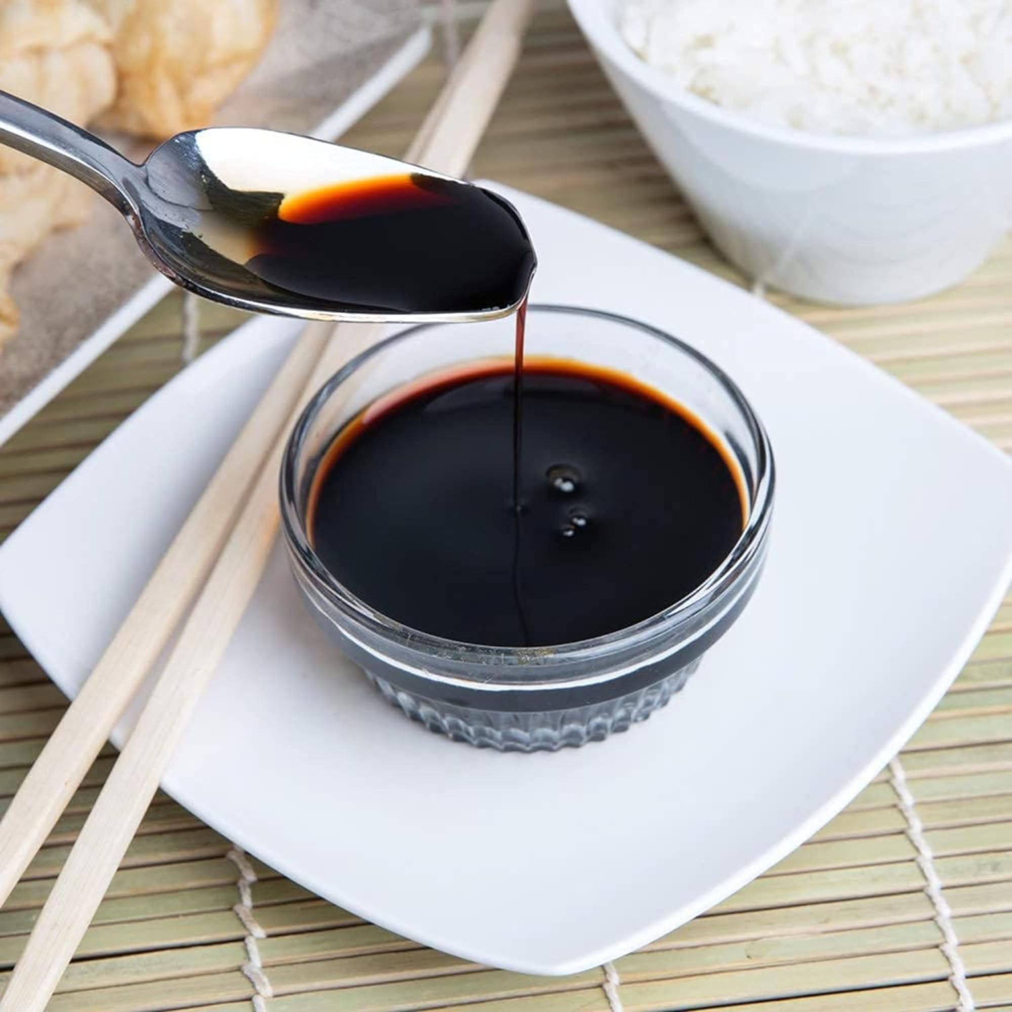 Kikkoman Lite Soy Sauce on a dinner table ready to season dishes.