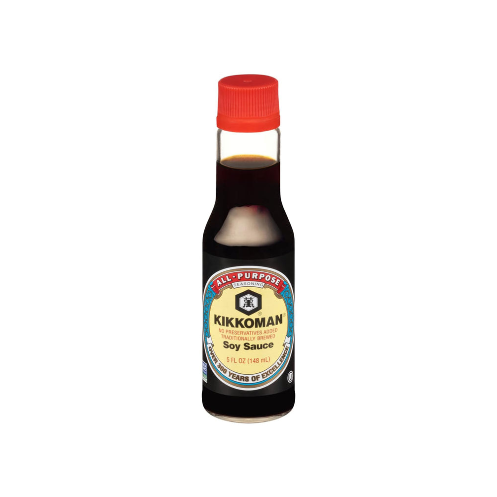 Kikkoman Naturally Brewed Soy Sauce bottle pouring into a dish for savory marinades.