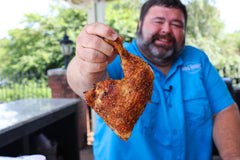 Killer Hogs AP Seasoning being sprinkled on vegetables for enhanced savoriness.