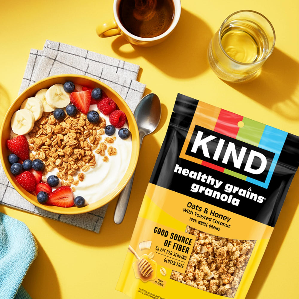 KIND granola sprinkled over yogurt, adding fiber and natural sweetness