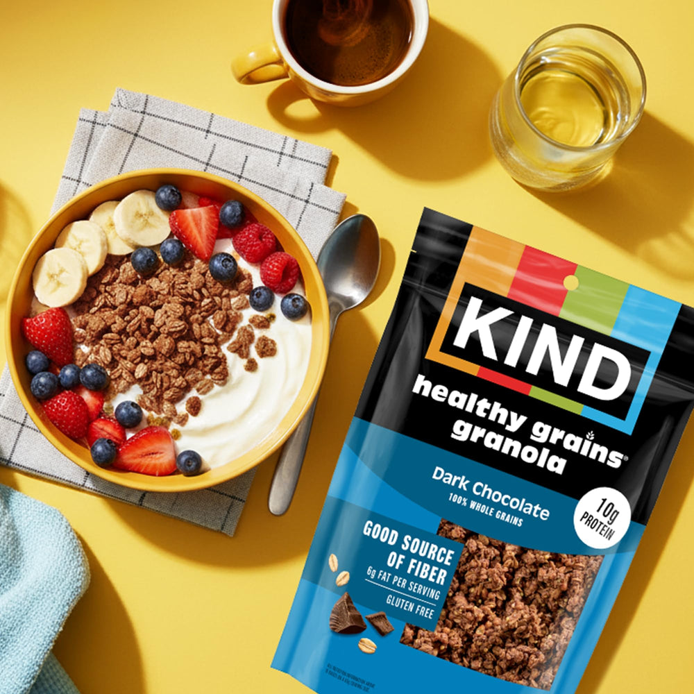 Kind granola clusters sprinkled over yogurt, ready to eat