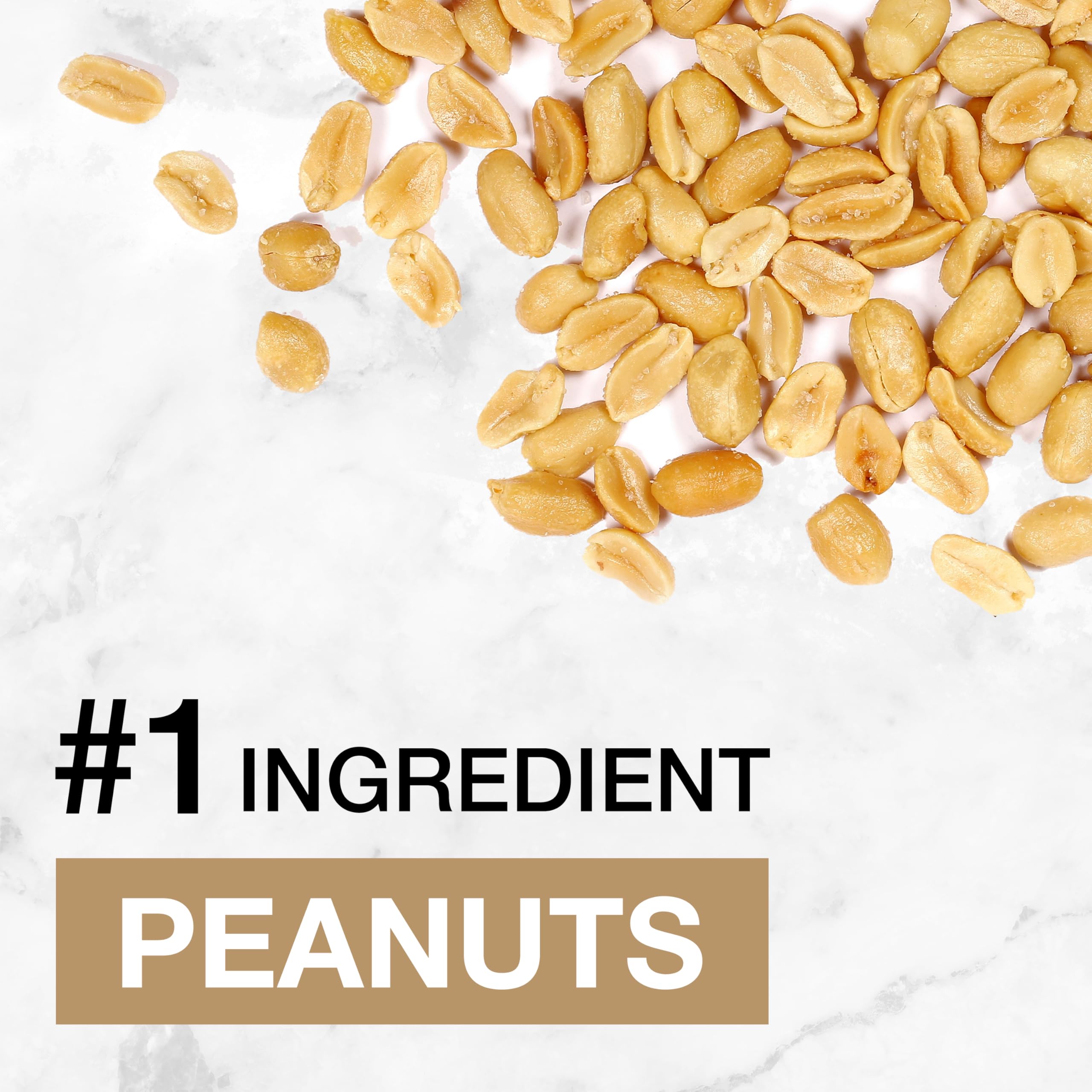 Bar broken in half showing crisp texture and peanuts.