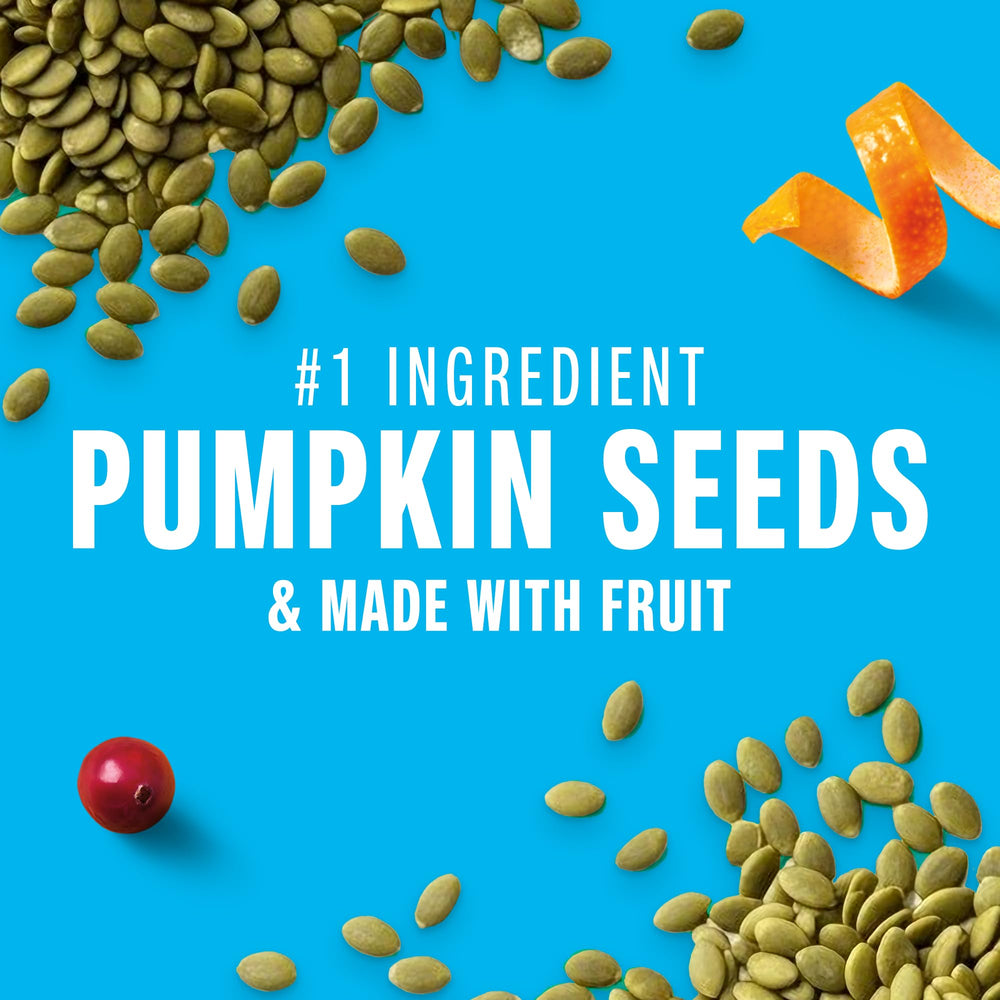 Pattern of pumpkin seeds and almonds on a KIND Seeds bar emphasizing texture.