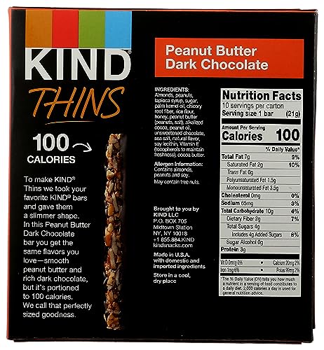 Kind Thins bar cross-section shows sliced cashews with chocolate.
