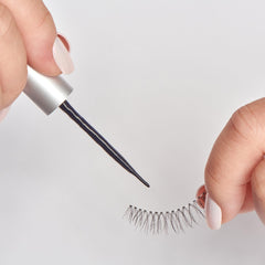 KISS SuperStick brush applicator enables precise lash placement.