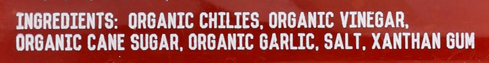 Kitchen and Garden Organic Sriracha label close-up highlighting ingredient list and clean branding.