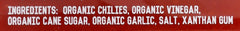 Kitchen and Garden Organic Sriracha label close-up highlighting ingredient list and clean branding.