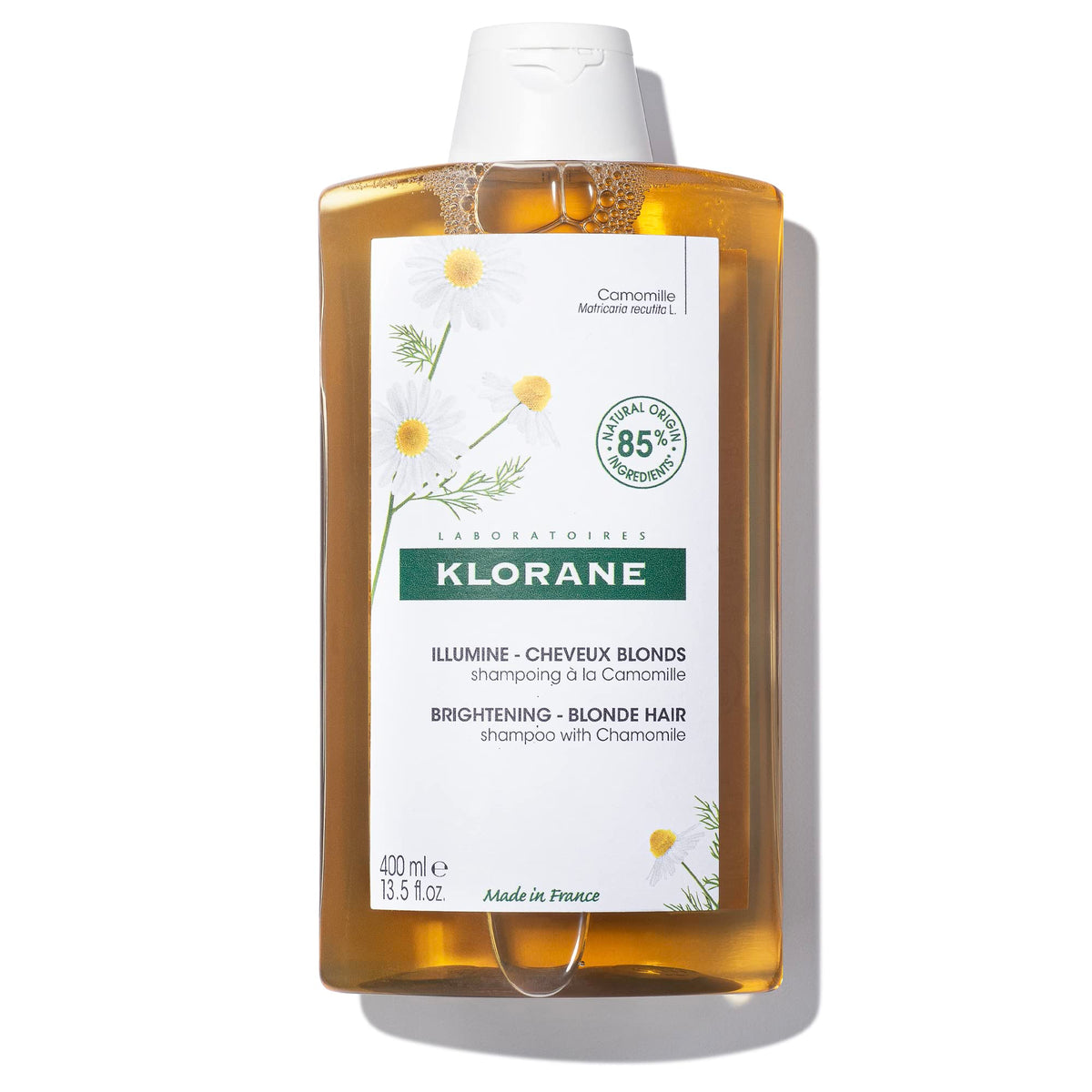 Klorane Brightening Shampoo with Chamomile bottle adds luminous shine to blonde hair.