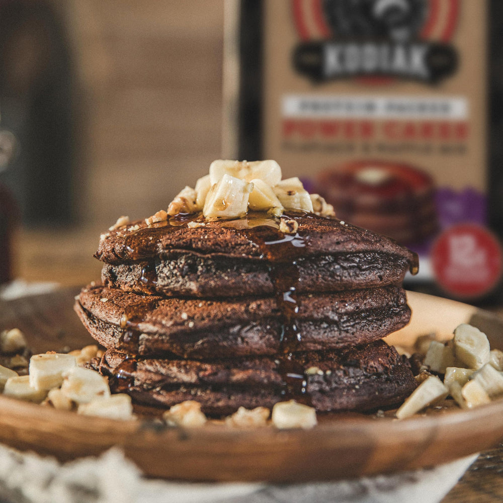 Nutrition label shows 14g protein per serving for Kodiak Cakes mix.