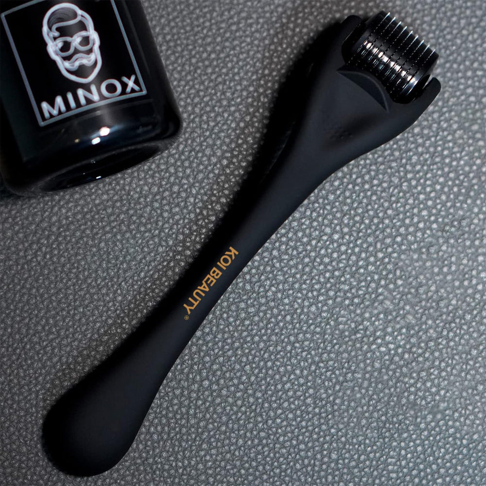 Koi Beauty derma roller in a home skincare setup for micro-needling.