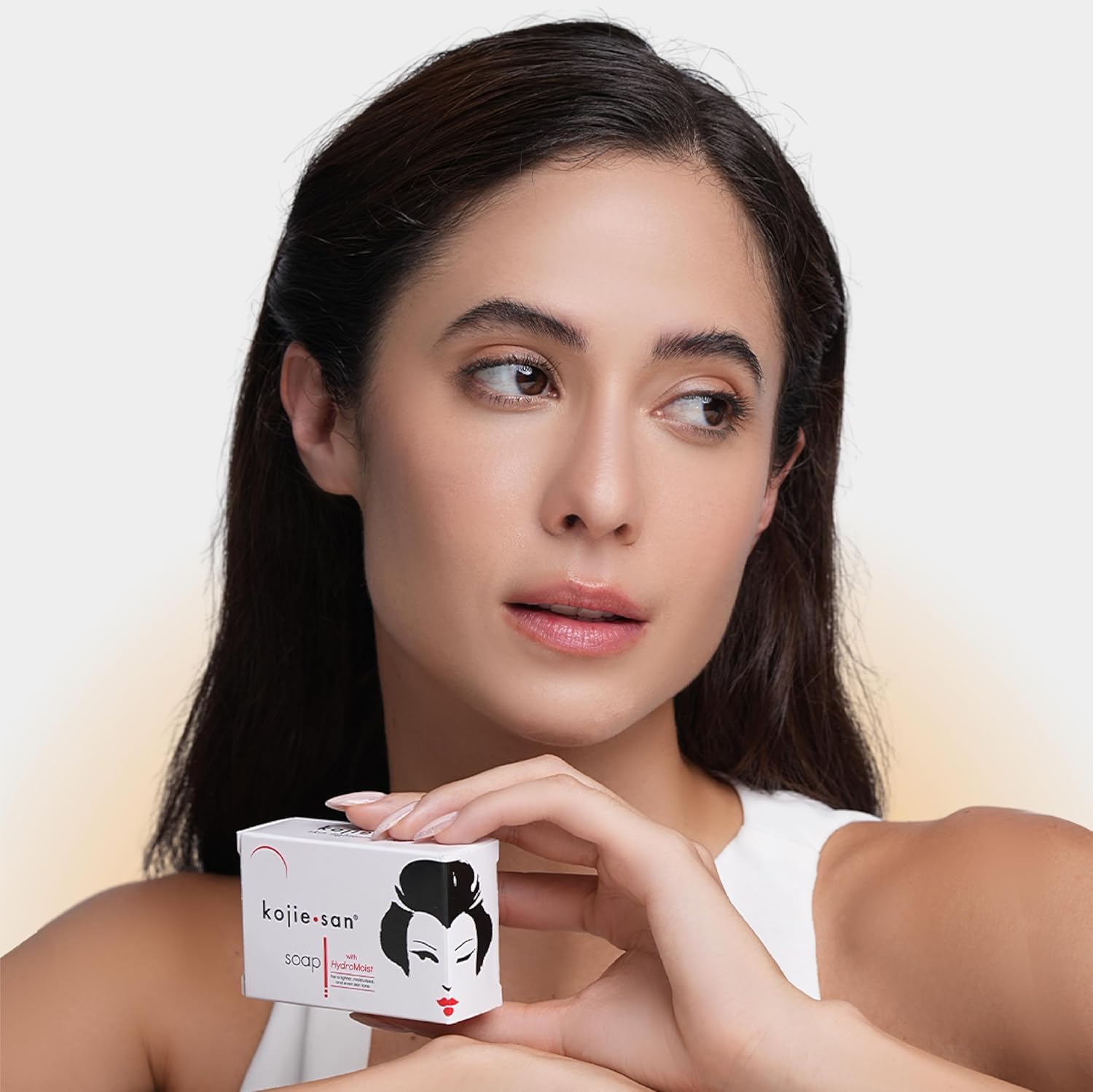 Kojie San usage shot showing face and body cleansing routine.