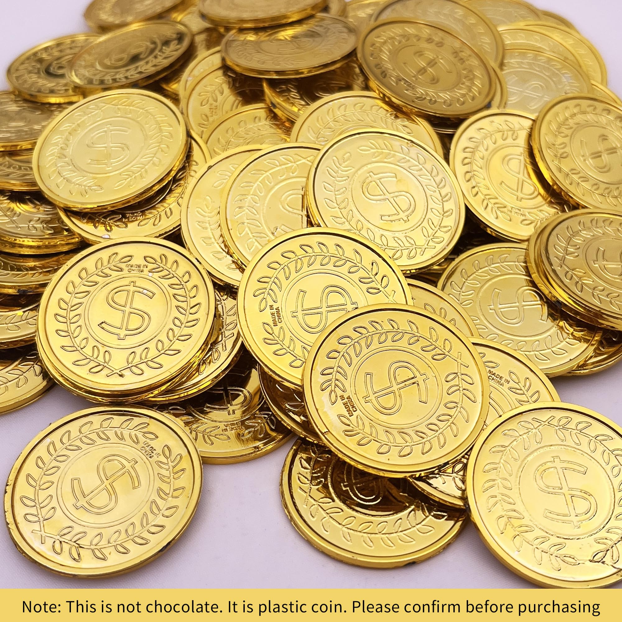 KOMIDK gold-plated plastic coins shown with a treasure chest for games