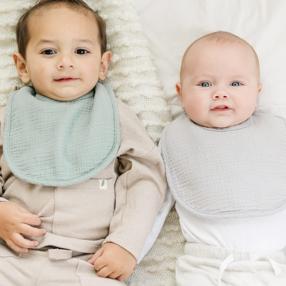 Konssy bibs shown as burp cloths for multi-use care.
