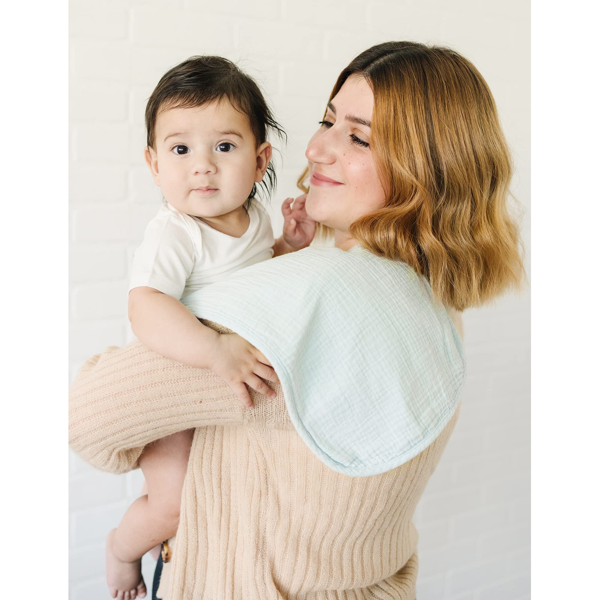 Konssy burp cloths on newborn shoulder showing full coverage size