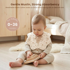 Konssy Muslin Baby Bibs fabric close-up highlights breathable cotton for gentle skin contact.