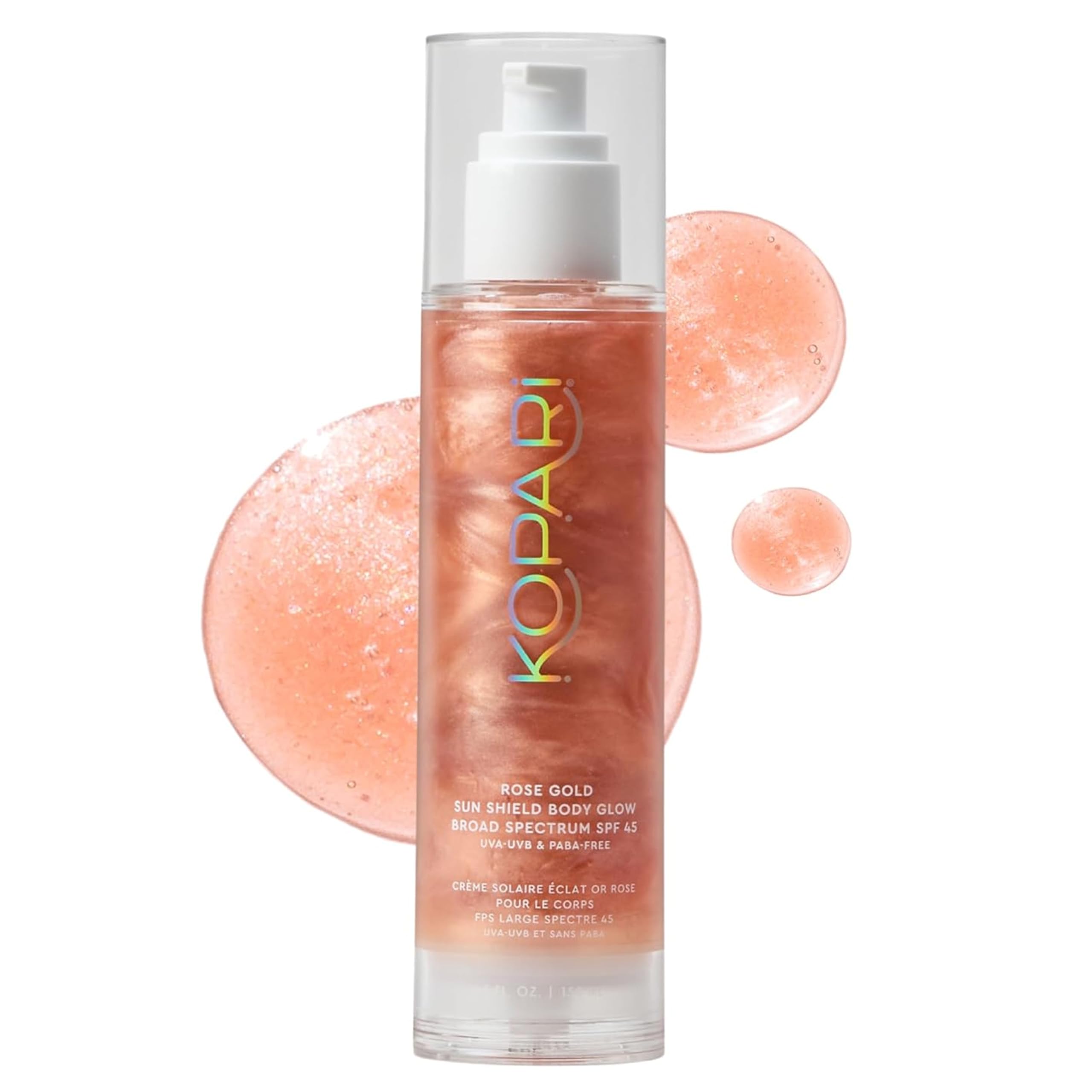 Kopari Sun Shield Body Glow bottle with rose-gold shimmer for radiant skin.