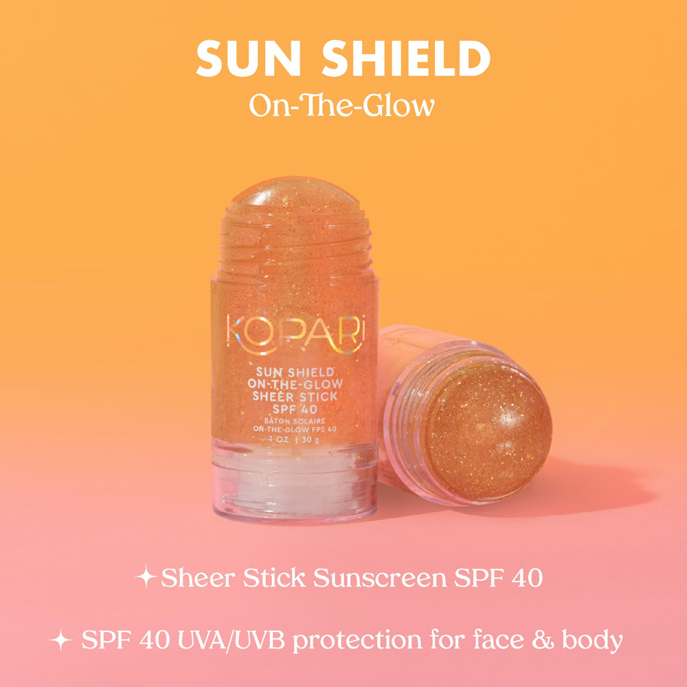 Kopari Sun Shield On-The-Glow stick gliding on skin for easy reapplication