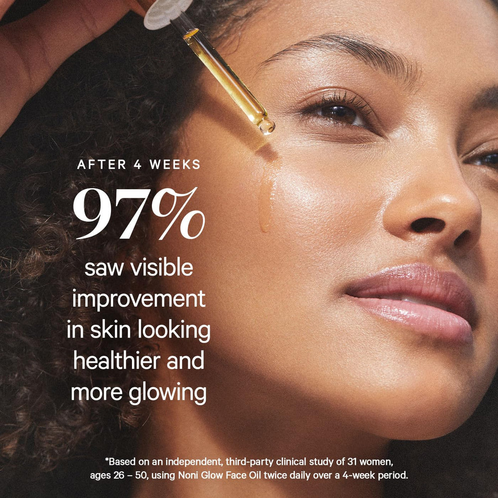 KORA Organics Noni Glow Face Oil applied on hands for facial care routine