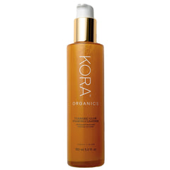 KORA Organics Turmeric Glow Foaming Cleanser bottle highlights organic formula for radiant skin.