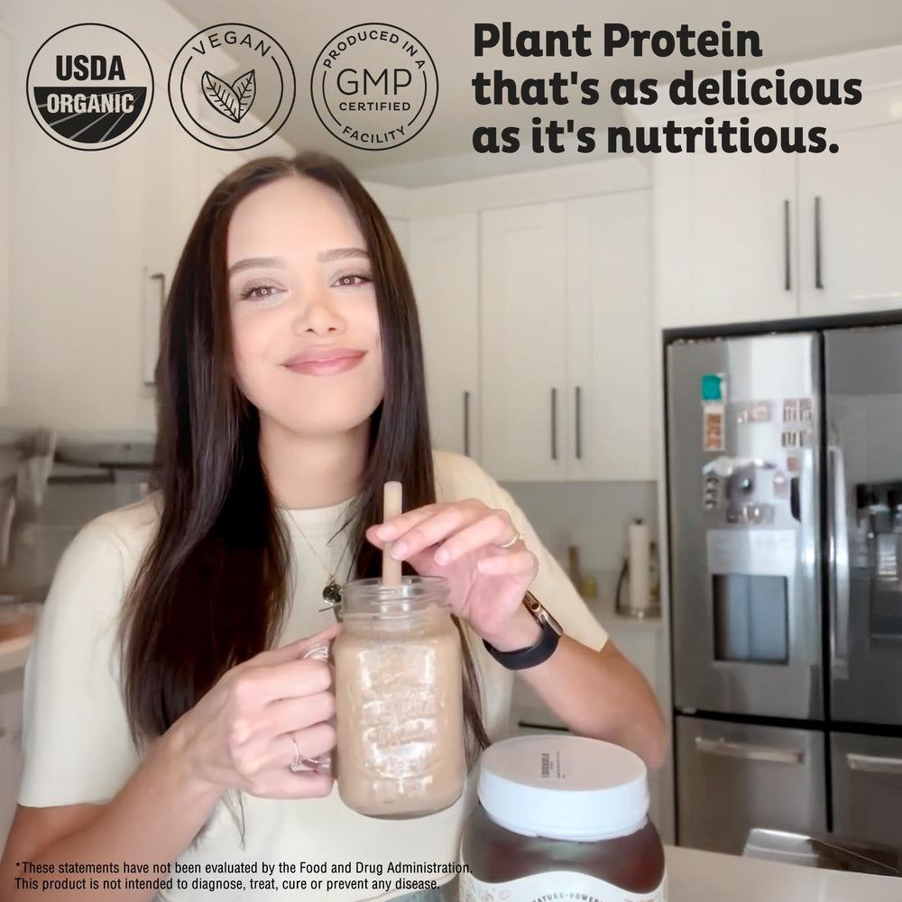 Scoop of KOS chocolate protein powder ready to mix into a refreshing shake.