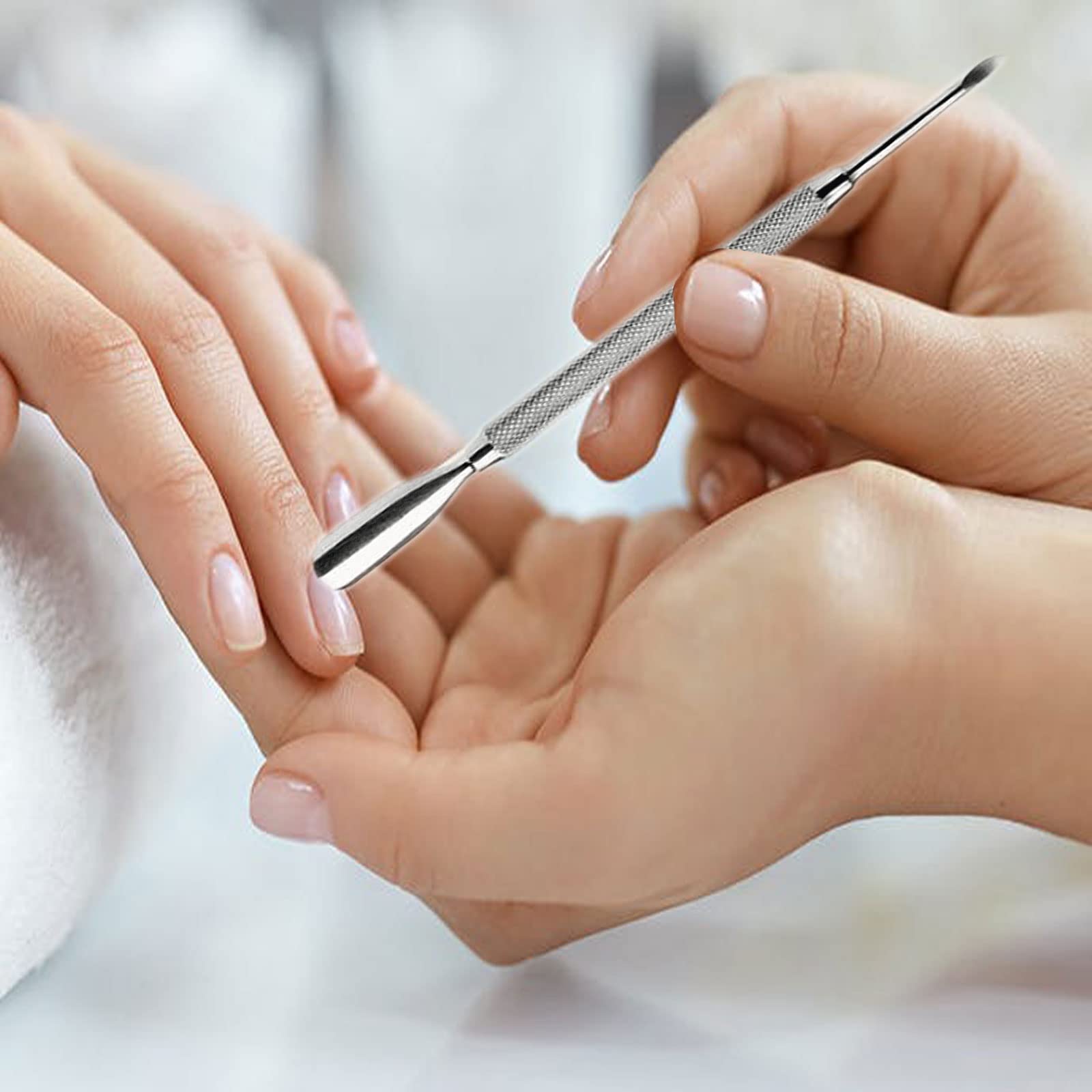Krisp Beauty metal scraper and cleaner for under-nail debris removal.