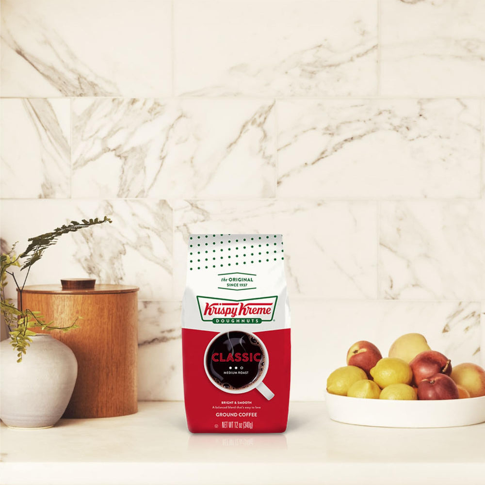 Pouring Krispy Kreme Classic coffee into a mug for the day.