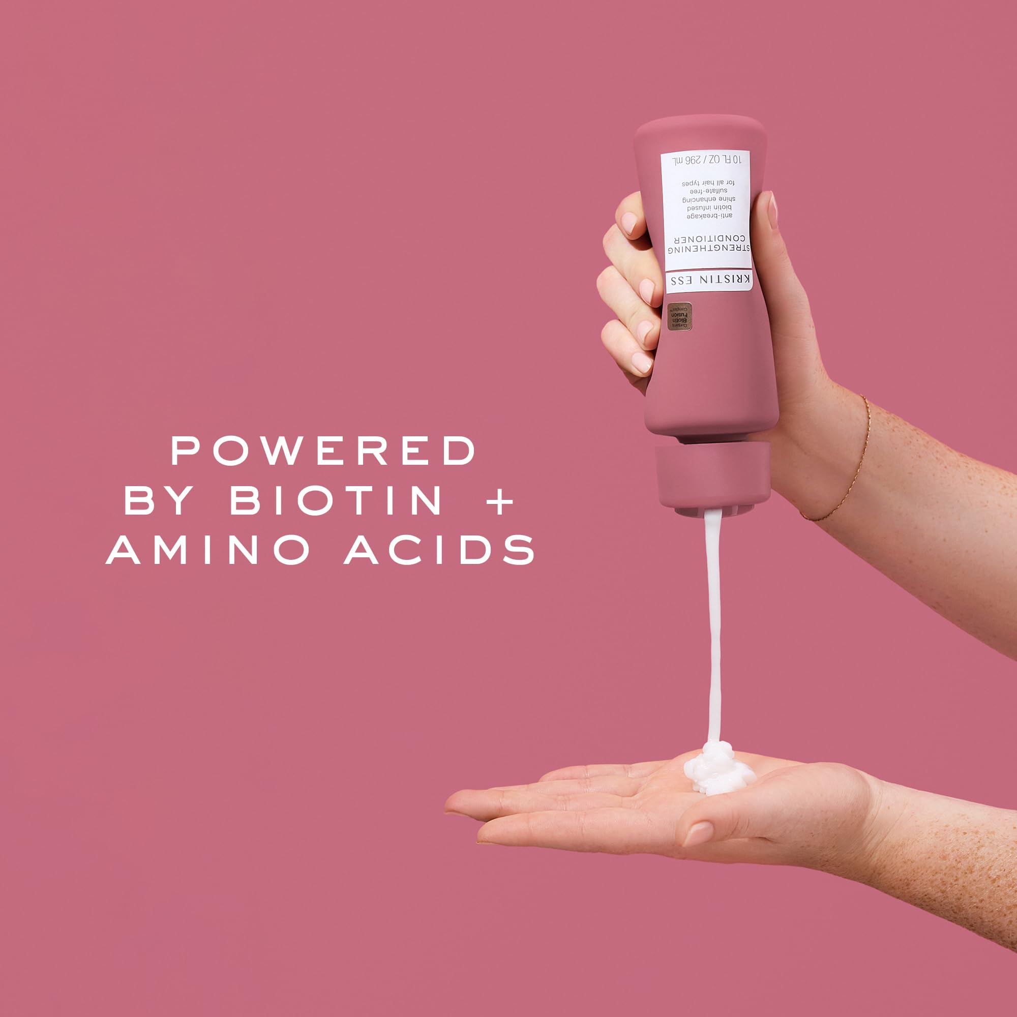 Kristin Ess Biotin Deep Conditioner being applied to hair during routine