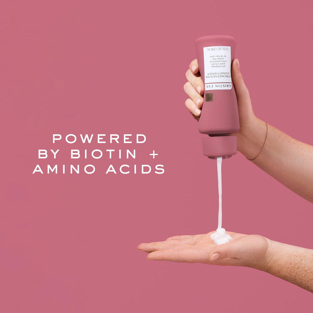 Kristin Ess Biotin Deep Conditioner being applied to hair during routine