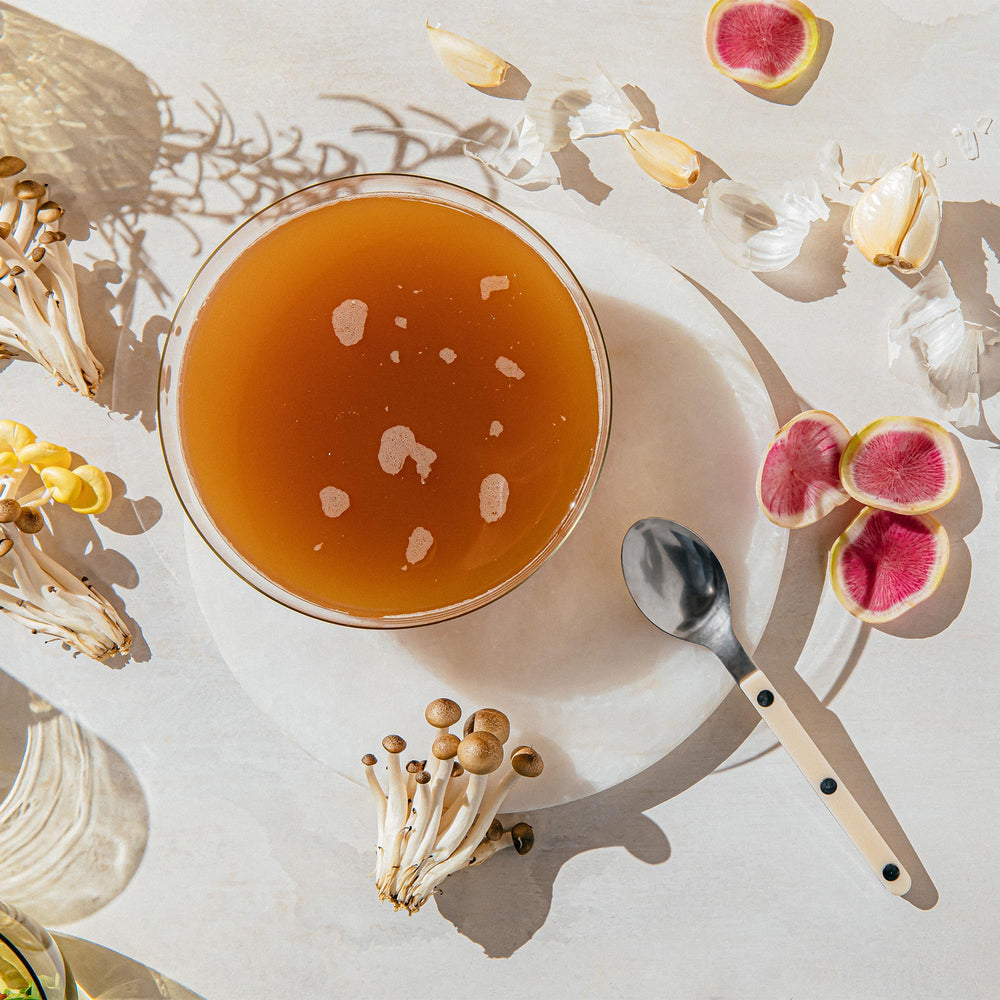 Kroma 24K daily wellness ritual with steaming cup for digestion-friendly use.