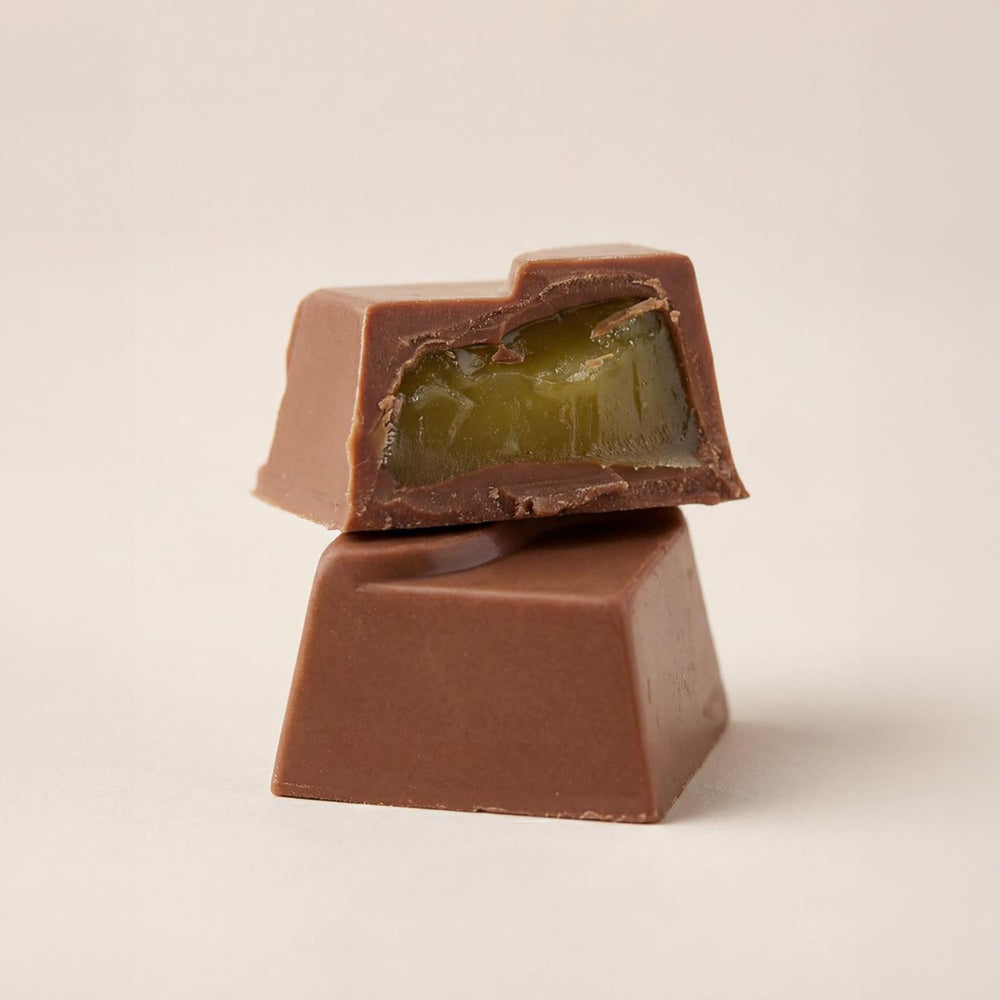 Ksana Choco 16-piece Assorted Praline box close-up, gift-ready.