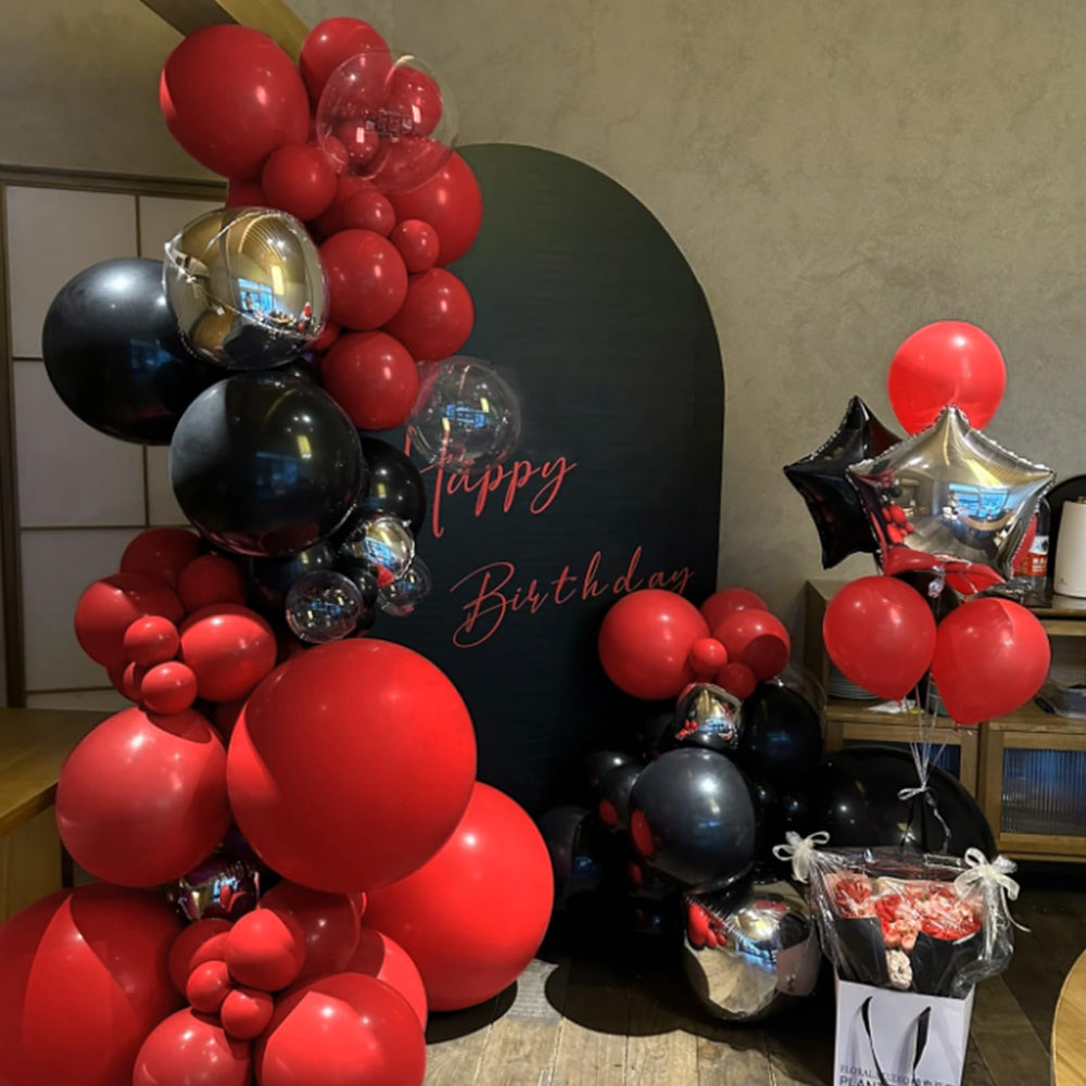 KUULBELA balloon arch kit showing a dramatic red arch