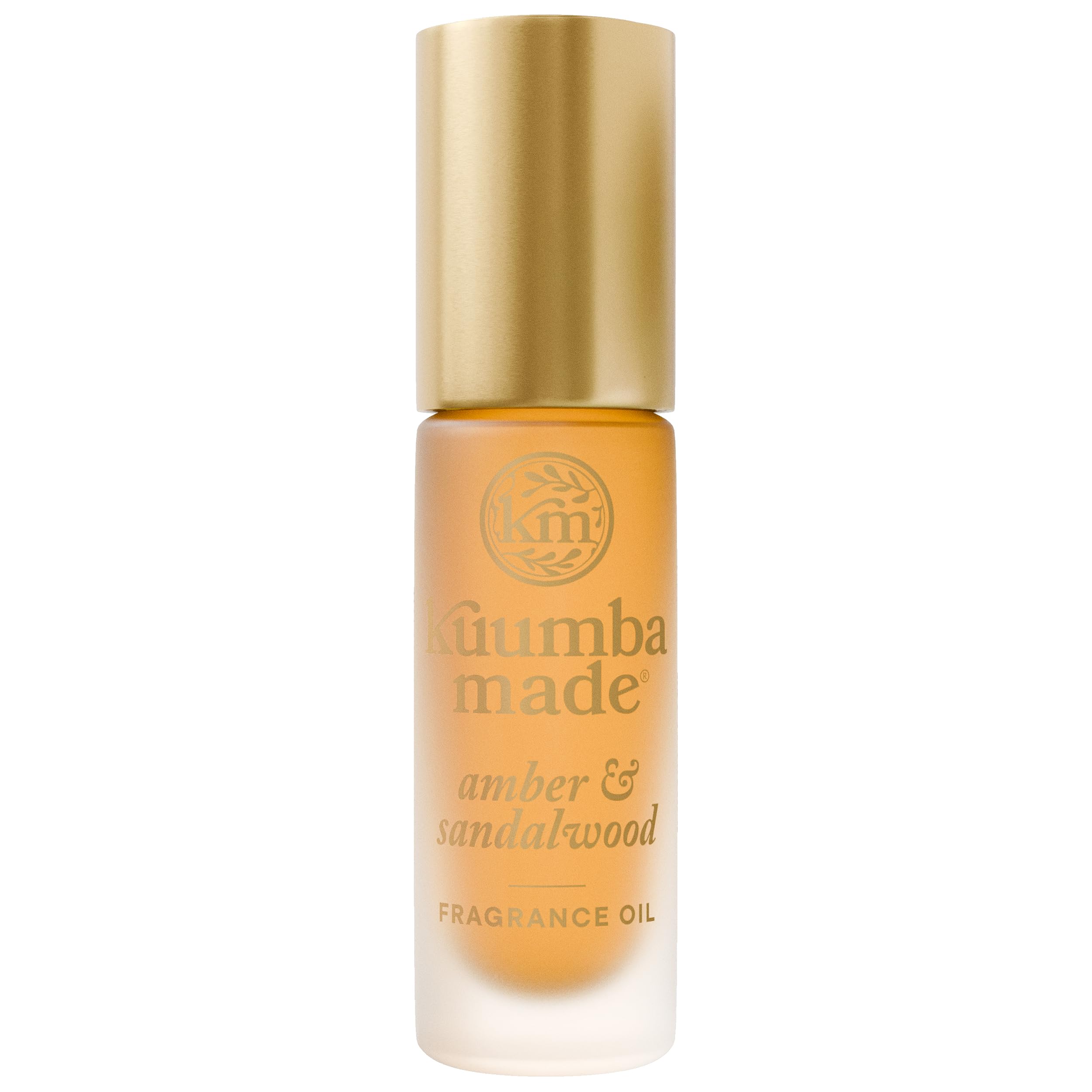 Kuumba Made Amber & Sandalwood bottle close-up for everyday luxury.