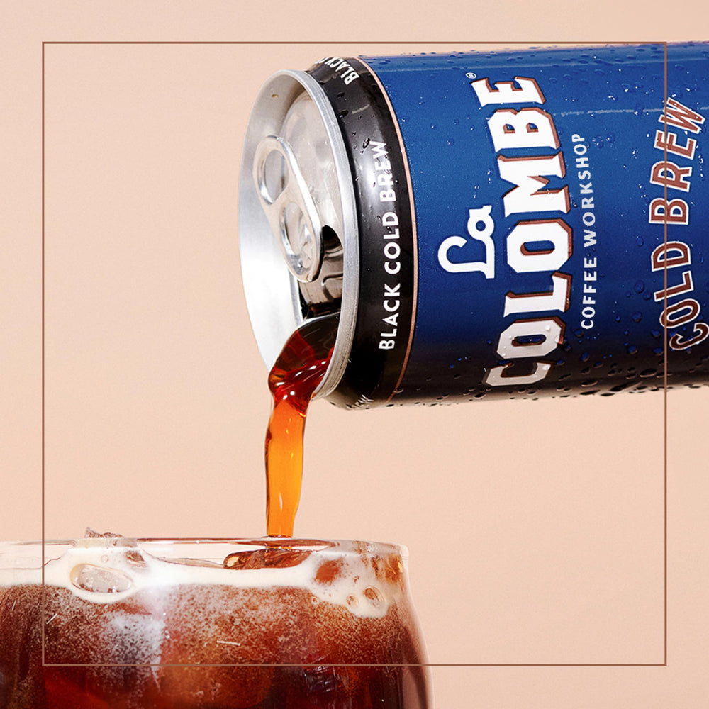 La Colombe Cold Brew Black cafe-counter scene conveys cafe quality.