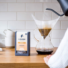 La Colombe Nizza beans in a grinder ready to brew espresso or drip.