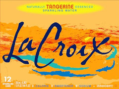 Glass being poured with La Croix Tangerine, capturing aroma and bubbles without calories.