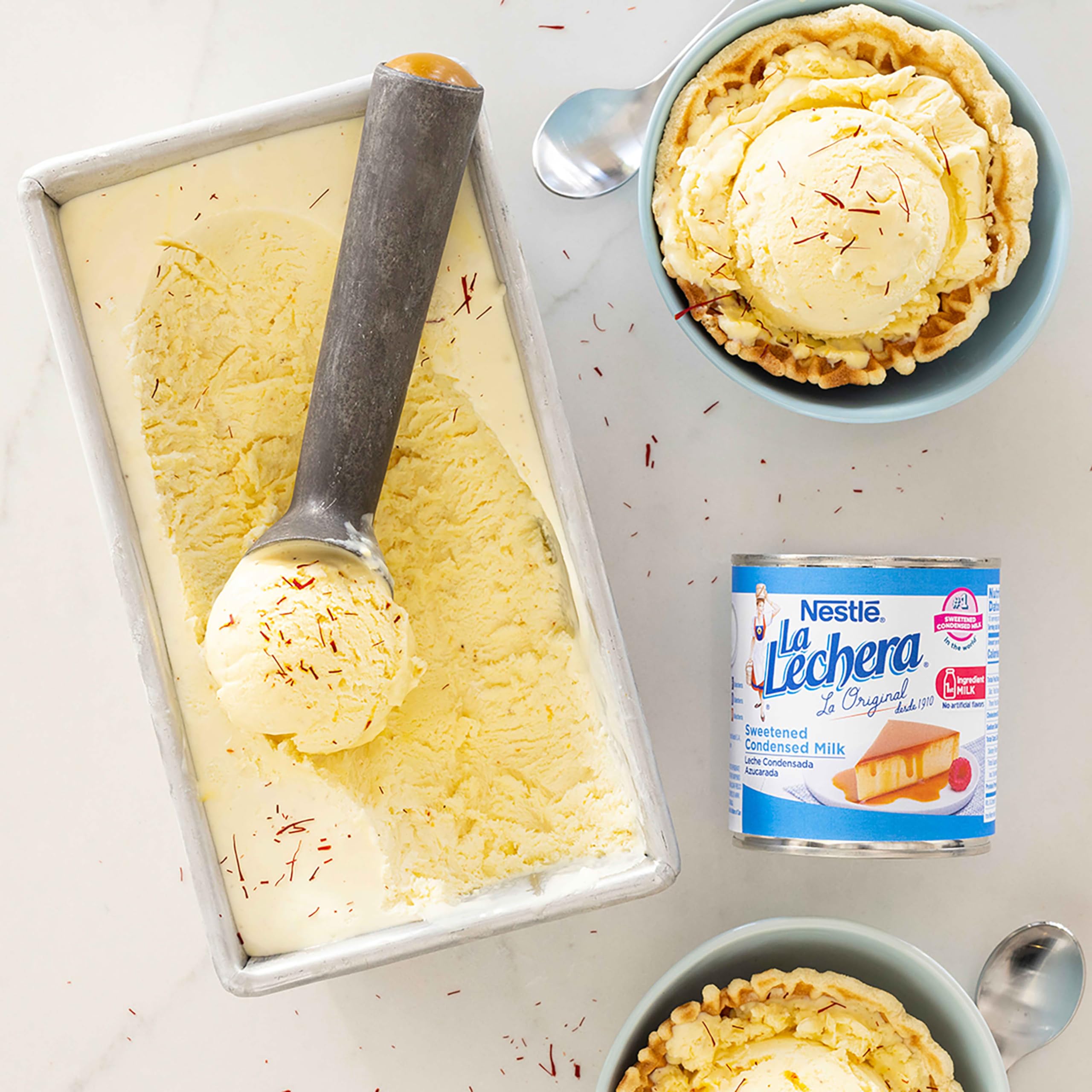 La Lechera beside tres leches cake for indulgent sweetness.