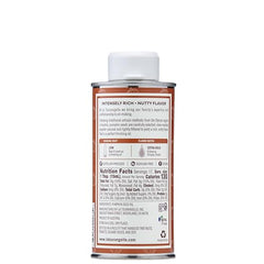 La Tourangelle Toasted Pumpkin Seed Oil bottle beside bread for spreads
