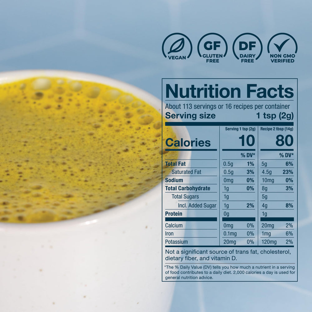 Close-up of turmeric powder in Laird creamer highlighting natural spice and color.