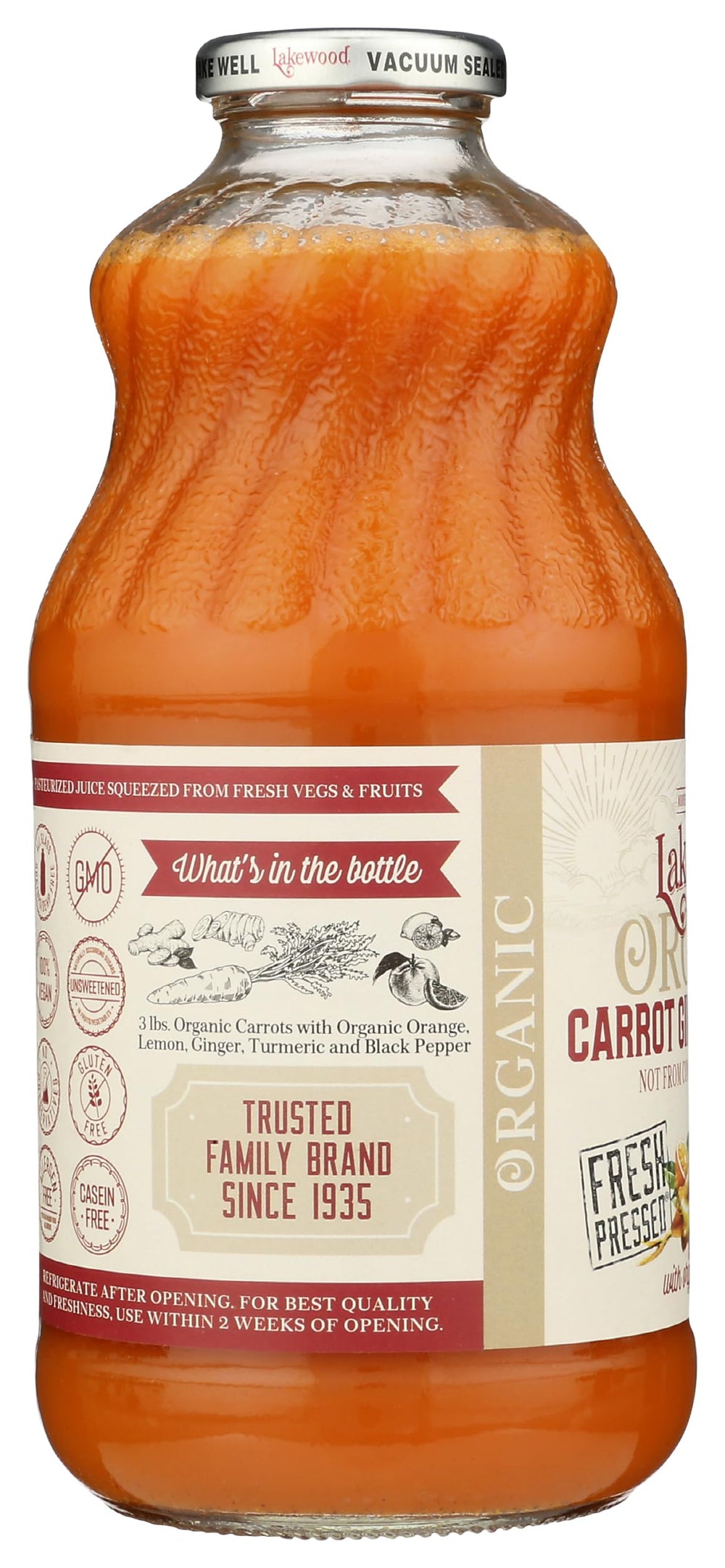 Lakewood organic ingredients closeup highlights fresh carrot, ginger, turmeric blend.