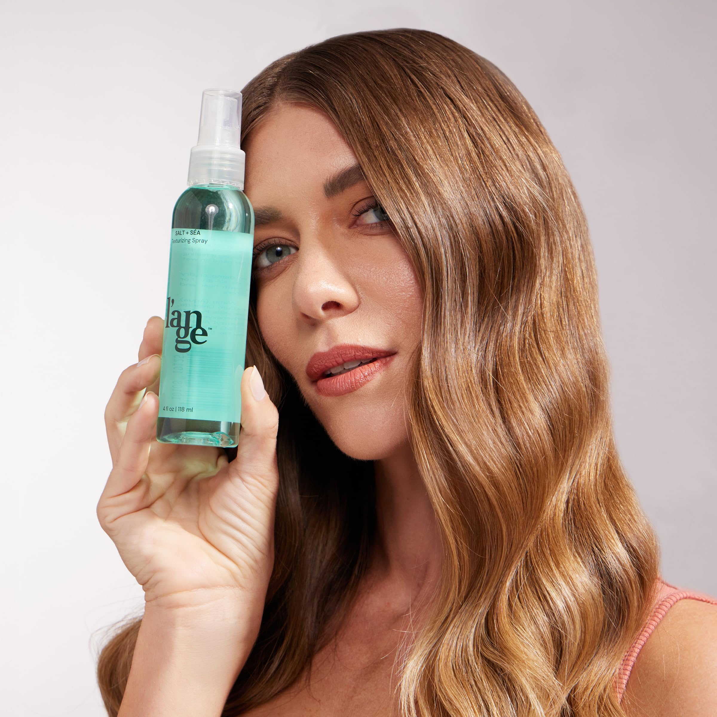 LANGE HAIR Sea Salt Texturizing Spray delivers a soft, natural finish.