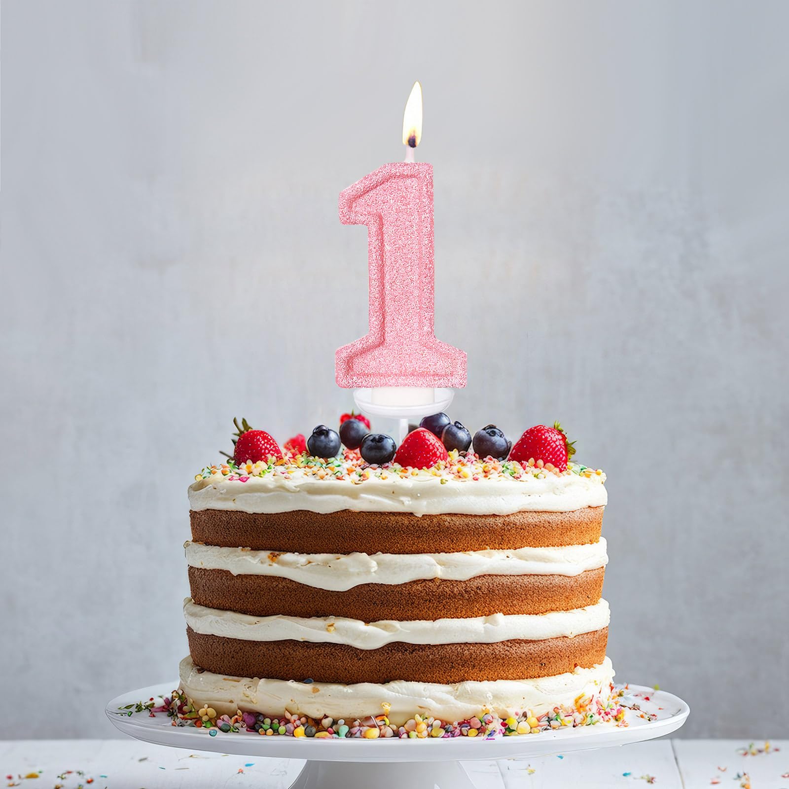 LASILE pink first birthday candle adding a cute focal point