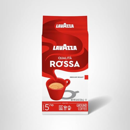 Lavazza Qualità Rossa beans in hand suggest fresh grinding and brewing ritual.