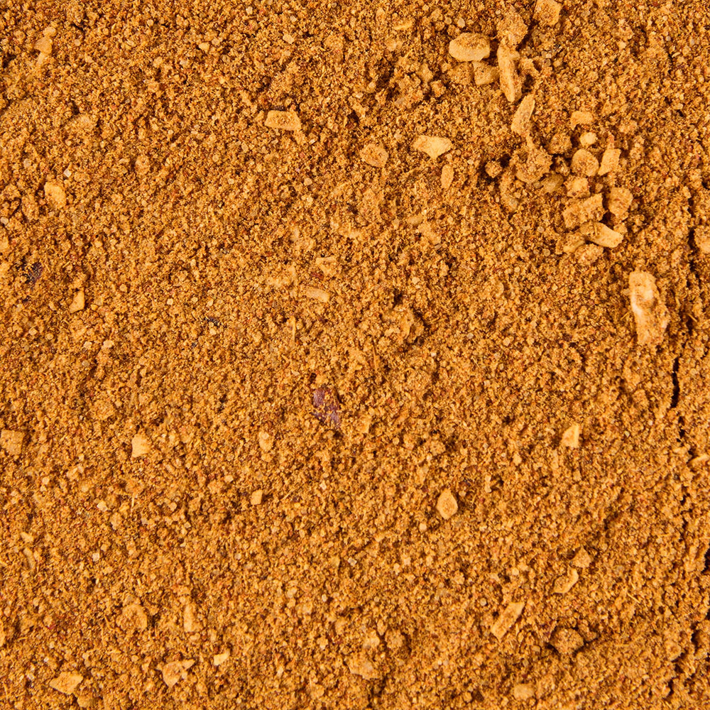 Lawry's taco seasoning closeup with tortilla chips ready to dip