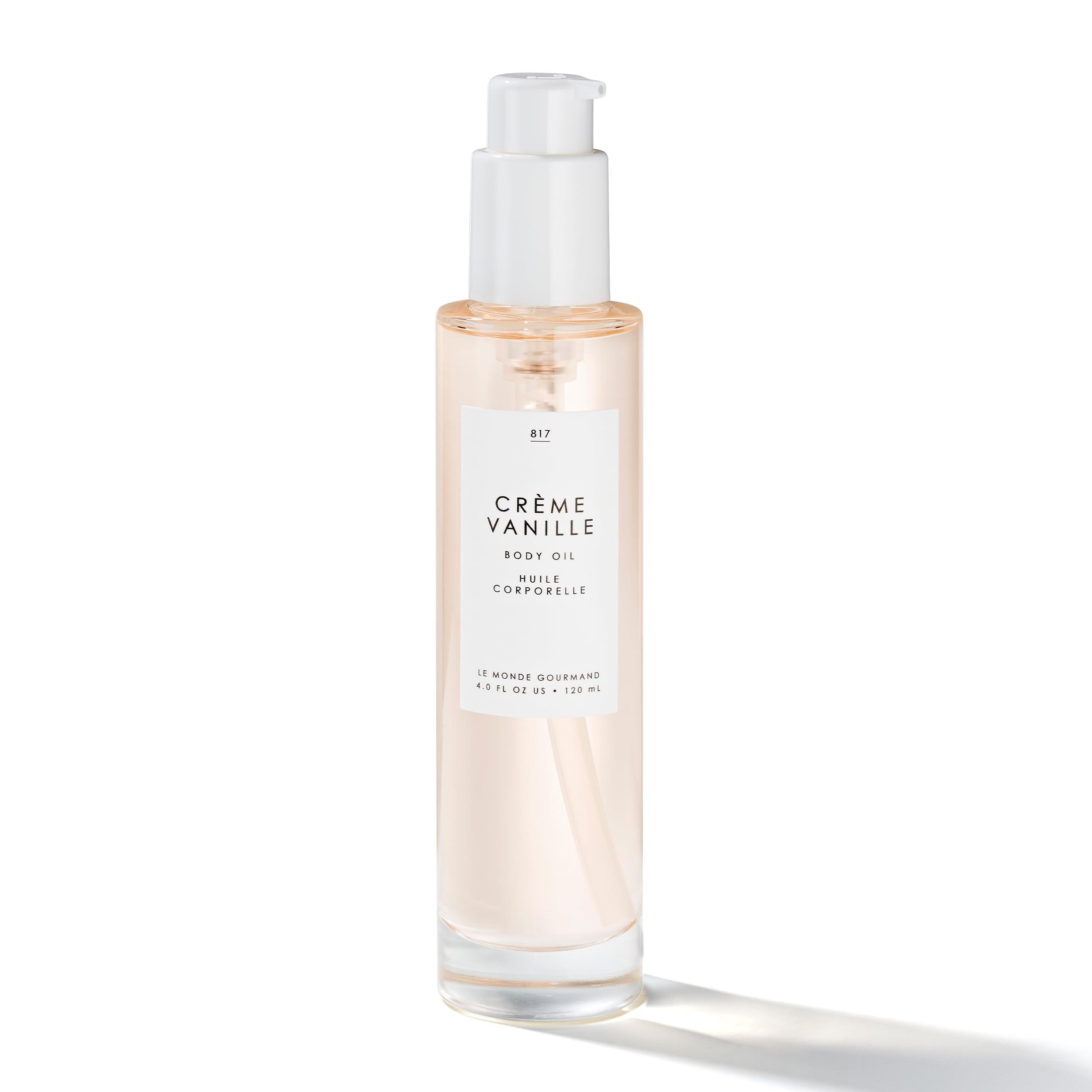 Le Monde Gourmand Crème Vanille Body Oil bottle pour promotes quick absorption on skin.