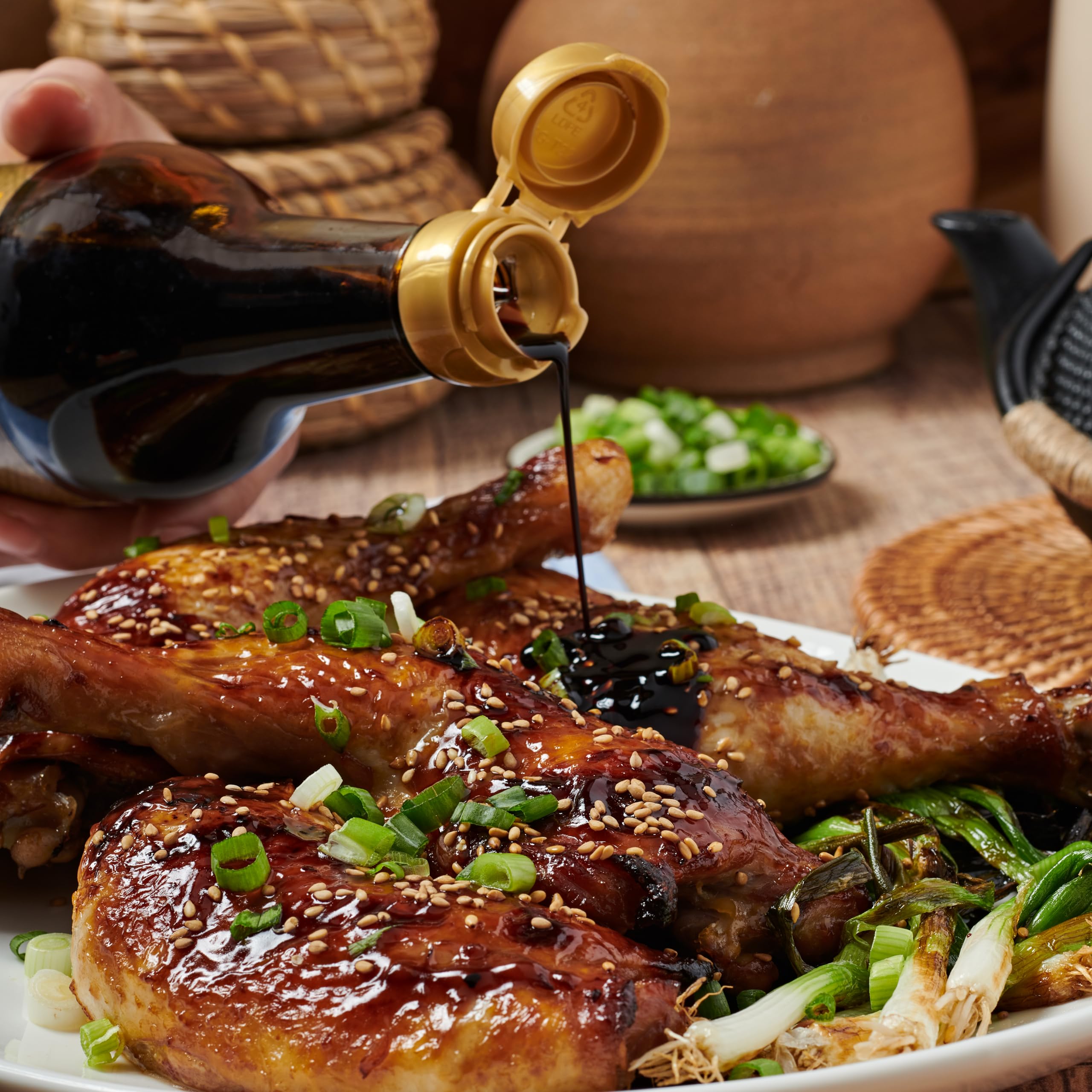 Lee Kum Kee Premium Dark Soy Sauce bottle highlights natural color in dishes.