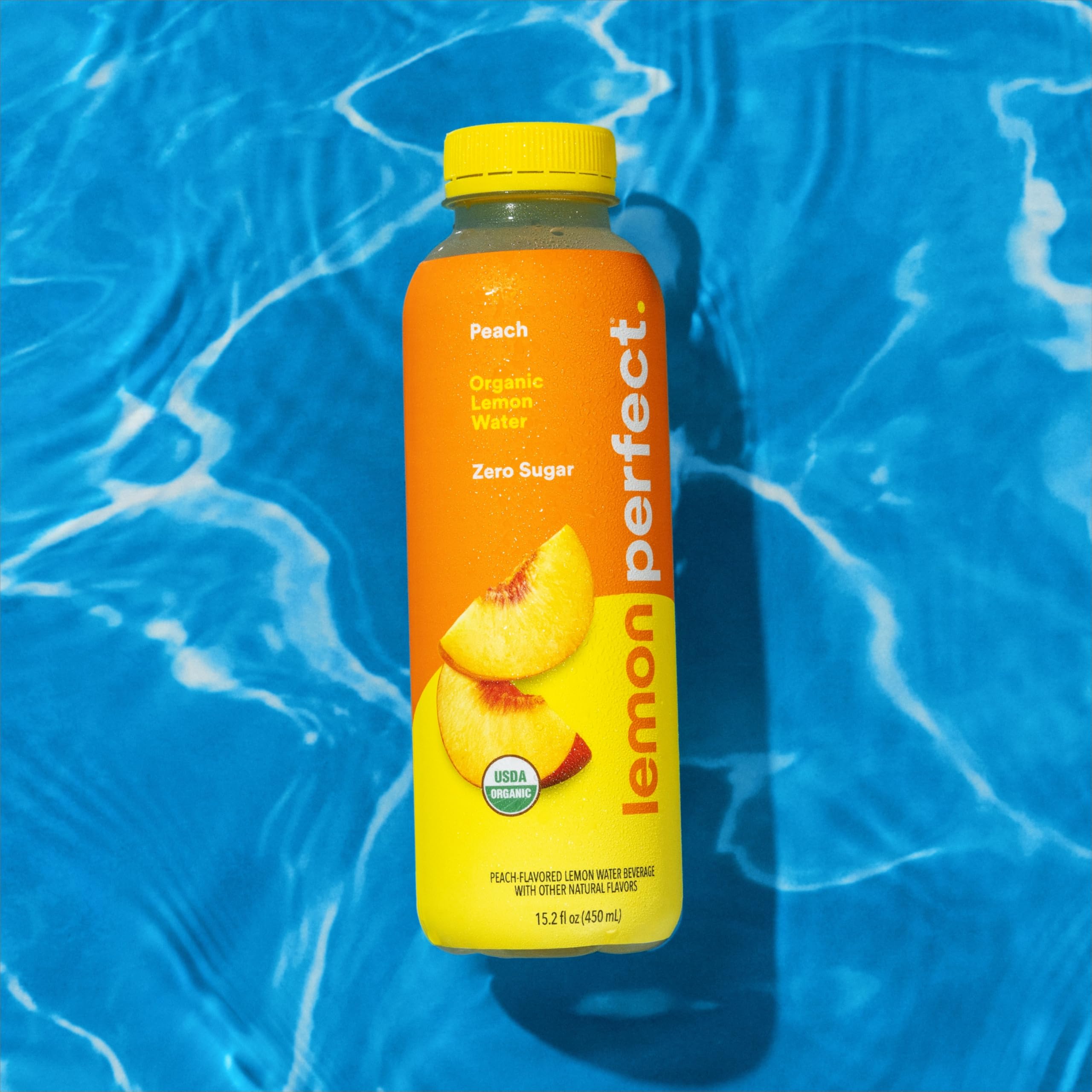Lemon Perfect Peach glass with ice illustrating versatile daily hydration