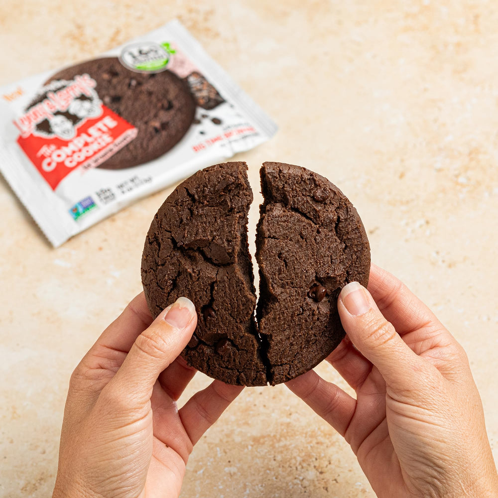 Store display of Lenny & Larry's Complete Protein Cookie Big Time Brownie pack