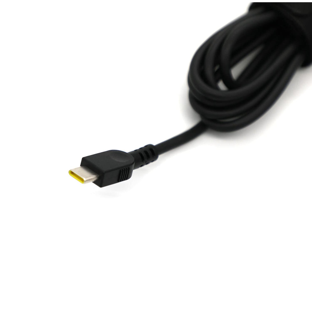 Lenovo 65W USB-C charger with cable neatly coiled for storage.