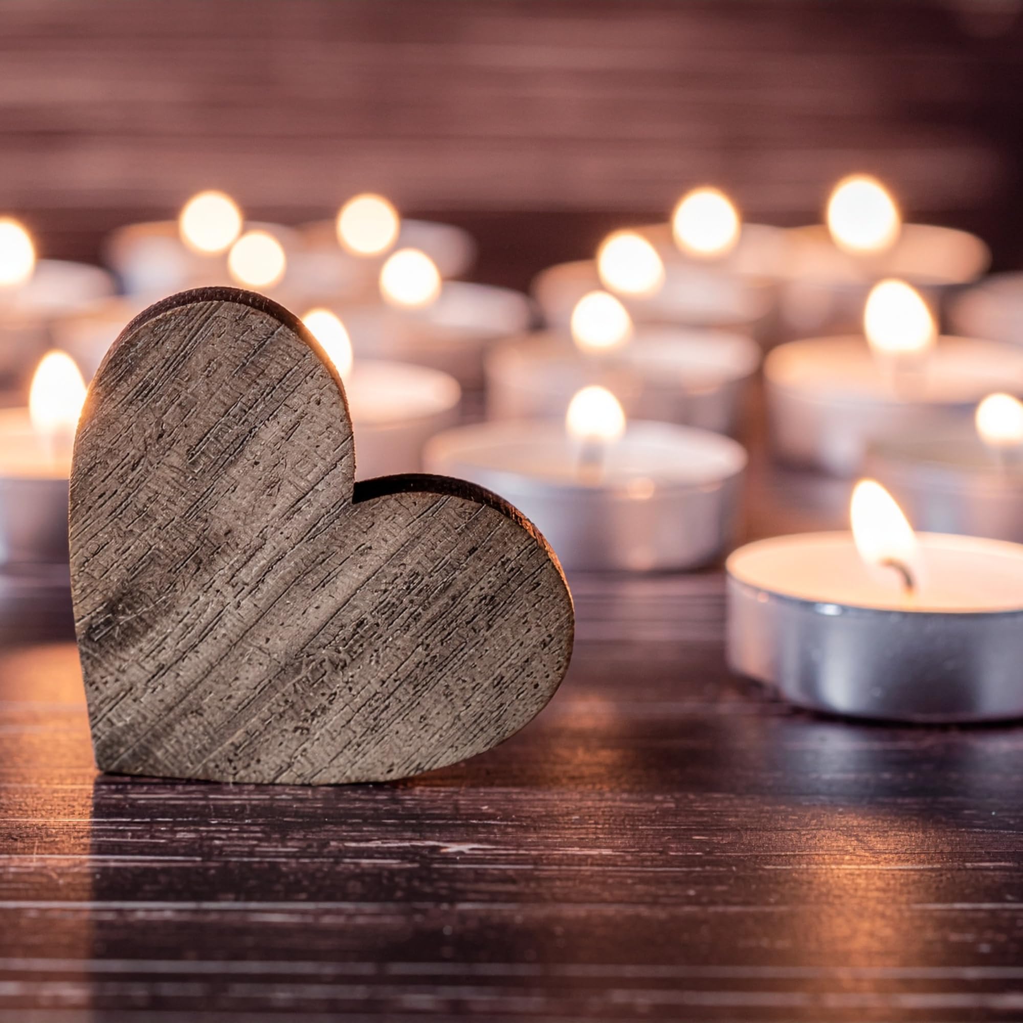 Leor and Lair tea lights on a dining centerpiece create intimate ambience.